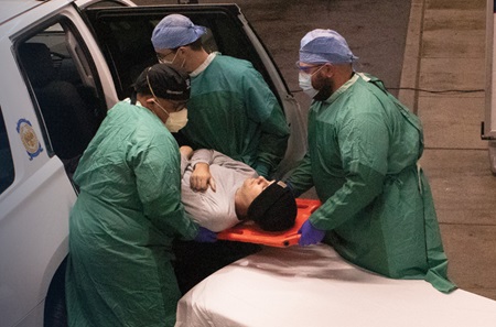 PPMC ED staff using a special technique to extract an injured patient from a police car